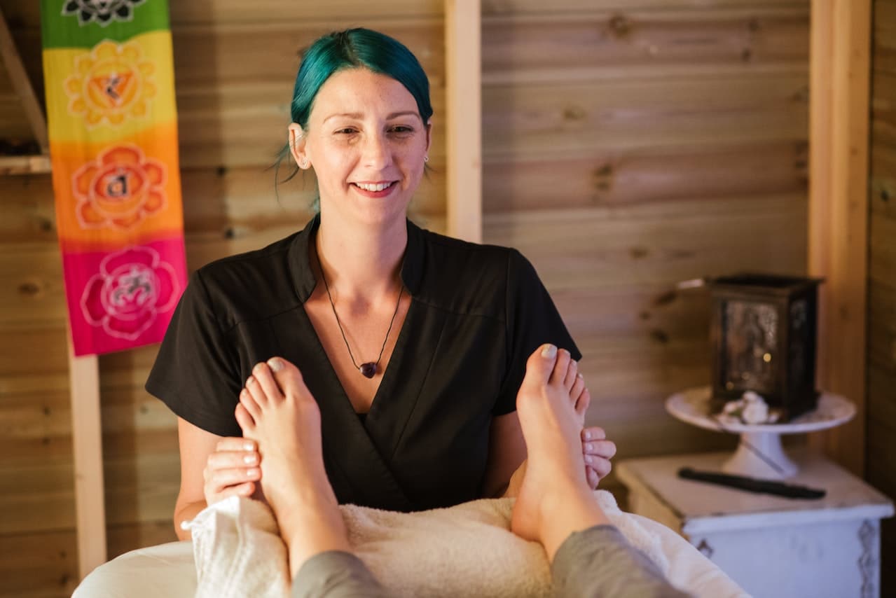massage therapist doing foot massage