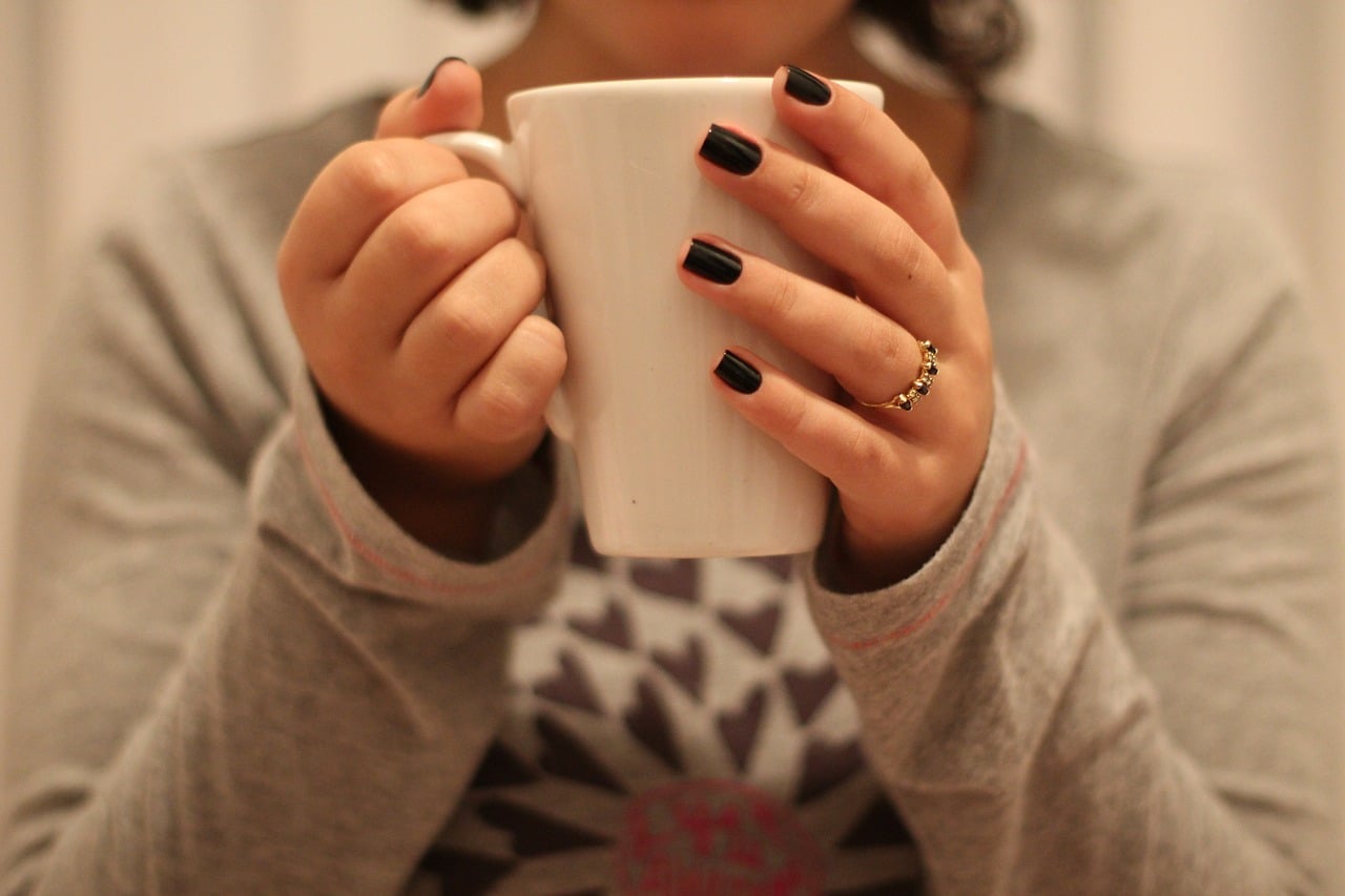 girl holding a cup